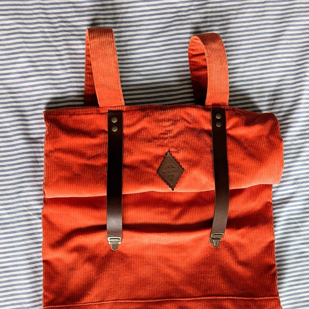 Vibrant orange corduroy roll top backpack 🎒
